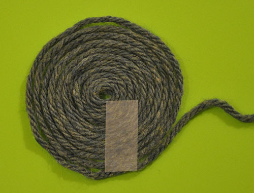 roll yarn into a flat spiral and tape it